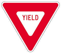 Red triangular yield traffic sign