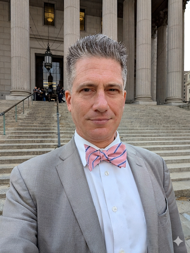Man in bow tie on courthouse steps